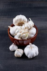 Fresh garlic cloves on a table, key for  healthy heart.