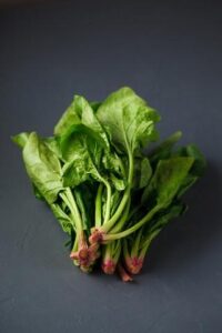 Bowl of fresh spinach, a heart-healthy superfood